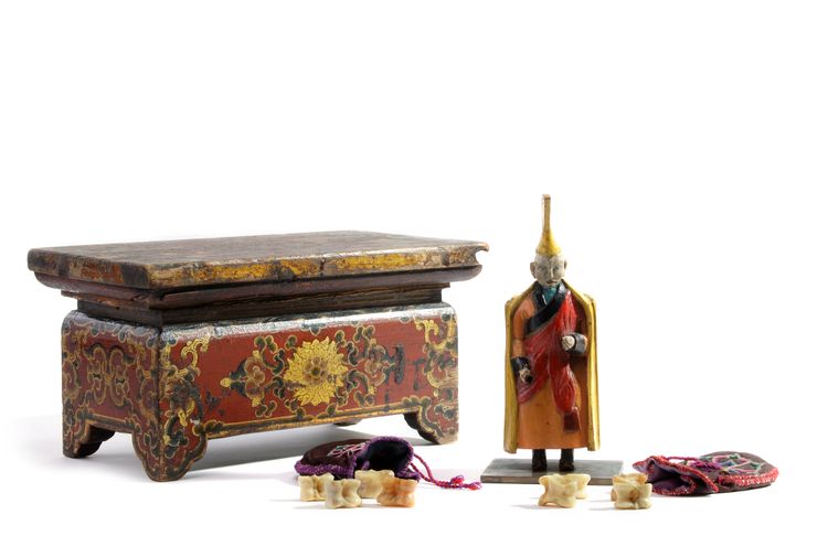 A MONGOLIAN LACQUERED WOOD OFFERING TABEL, A POLYCHROME-DECORATED WOOD FIGURE OF A LAMA AND TWO EMBROIDERED BAGS, 19TH-20TH CENTURY