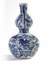 A Chinese blue and white moulded 'Kraak' 'seahorse' double-gourd vase