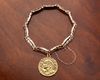 A 14 CARAT GOLD BRACELET WITH A 'SWISS 20 FRANC' GOLD COIN PENDANT
