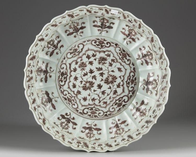 A Chinese Ming-style underglaze copper-red-decorated 'floral' charger