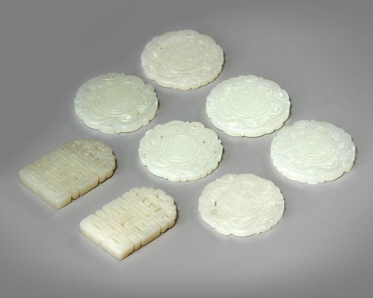 A group of eight small Chinese plaques