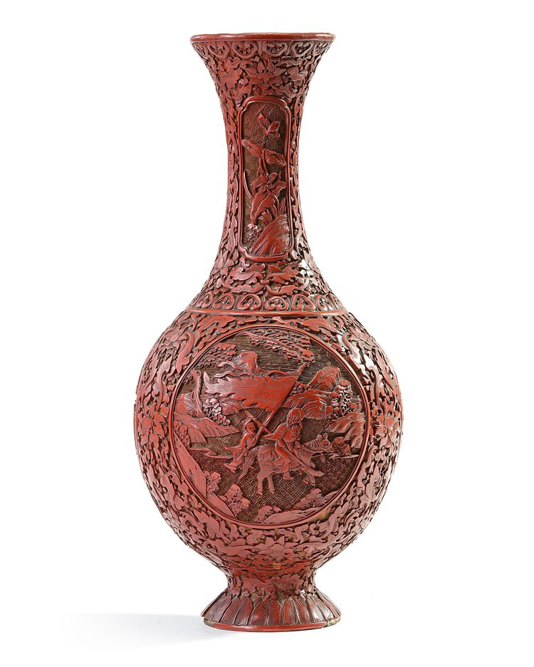 A Chinese carved cinnabar lacquer slender vase
