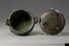 A Chinese bronze tripod ding and cover