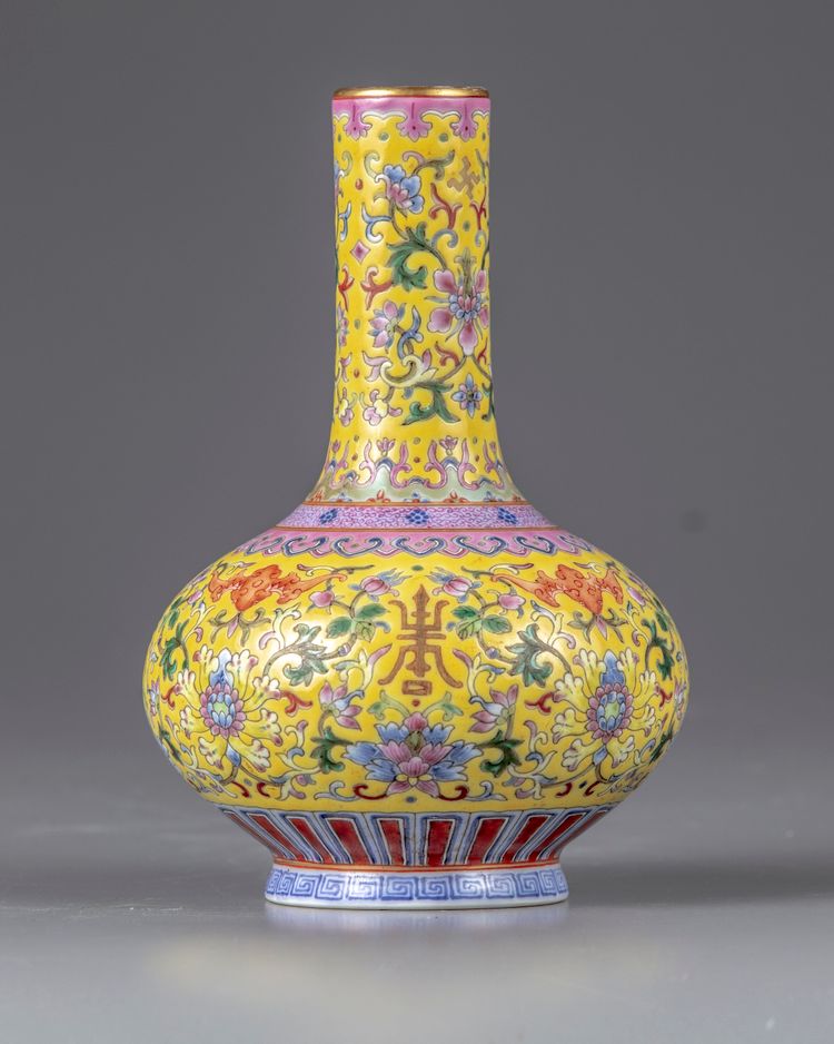 A yellow-ground famille rose bottle vase