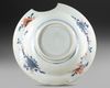 A CHINESE FAMILLE VERTE ‘PROVINCES’ ARMORIAL SHAVING BOWL, WITH THE ARMS OF GELDERLAND, CIRCA 1720