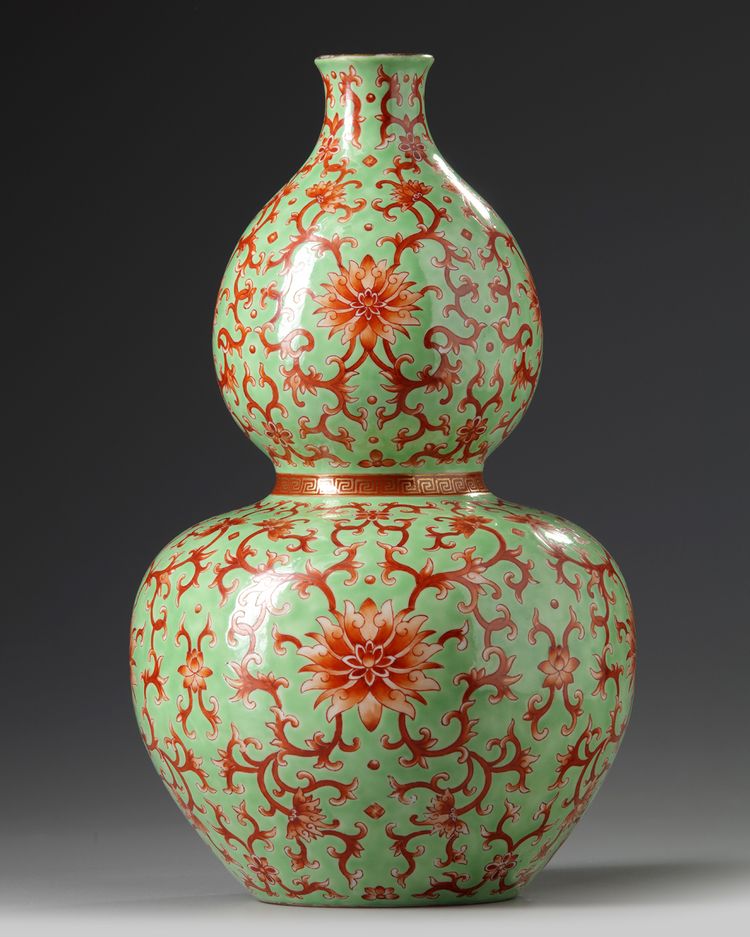 A Chinese lime green ground iron red decorated double gourd vase