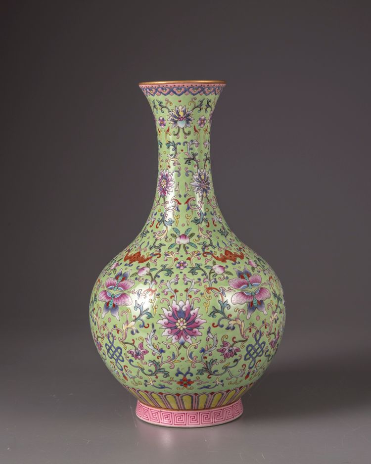 A green-ground famille-rose bottle vase