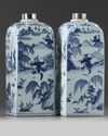 A pair of Chinese blue and white square bottles and silver covers