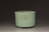 A Chinese celadon glazed tripod censer