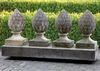 A SET OF FOUR CARVED LIMESTONE PIER FINIALS, 20TH CENTURY