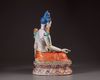 A Chinese famille rose figure of Avalokitesvara on a double lotus base