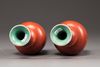 A matched pair of Chinese coral red-decorated double gourd vases