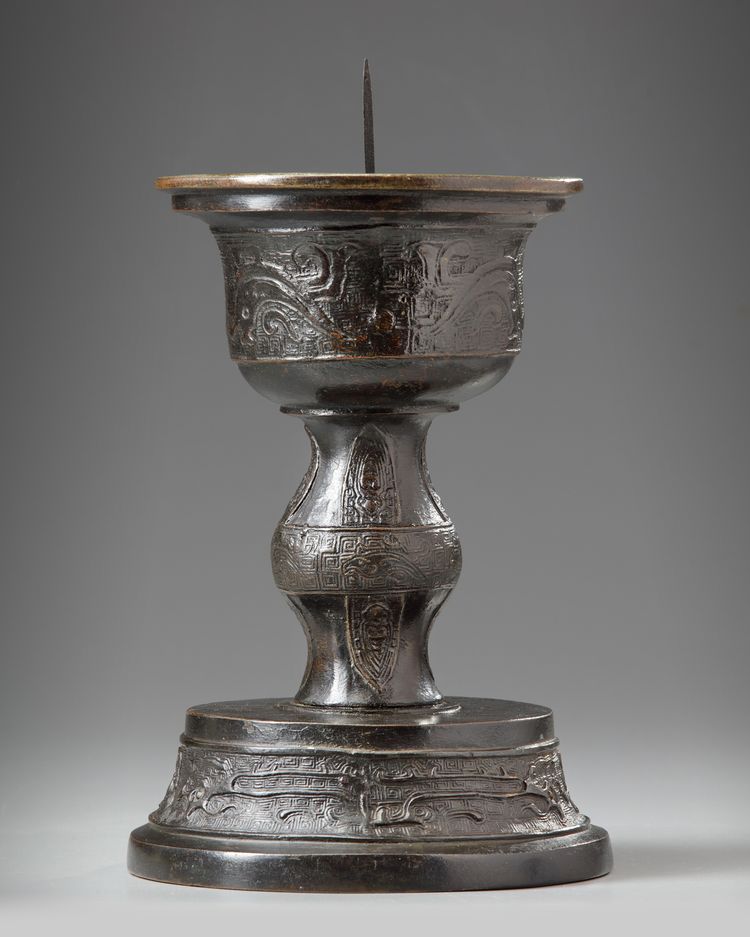 A Chinese bronze candle holder