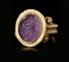 A ROMAN GOLD RING WITH AMETHYST INTAGLIO, CIRCA 2ND-3RD CENTURY A.D.