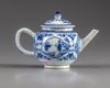 A blue and white teapot and cover