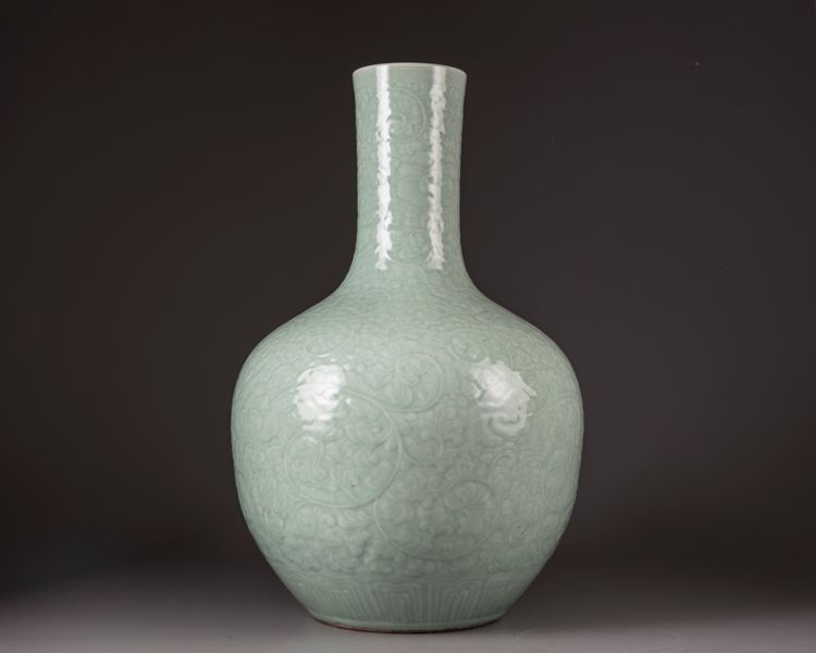 A large Chinese celadon-glazed moulded bottle vase