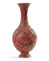 A Chinese carved cinnabar lacquer slender vase
