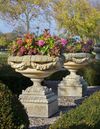 A PAIR OF CARVED LIMESTONE GARDEN URNS, LATE 20TH CENTURY
