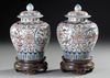 A PAIR OF FAMILLE ROSE VASES WITH LIDS ON WOODEN STANDS, CHINA, 19TH CENTURY