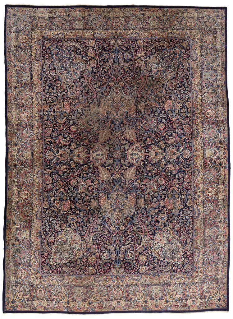 A KIRMAN RAWER CARPET