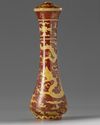 A CHINESE IRON-RED AND YELLOW-ENAMELLED 'DRAGON' BRUSH HANDLE, QING DYNASTY (1644-1911)