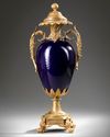 A GILT BRONZE MOUNTED SEVRES STYLE PORCELAIN VASE, 19TH CENTURY