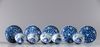 Five blue and white cups and seven saucers