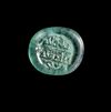 A FATIMID GLASS WEIGHT OF HALF DIRHAM, EGYPT AL-HAKIM BI-AMR ALLAH (386AH-411AH/ 996AD-1021AD)