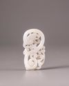A Chinese white jade 'twin dragon' plaque