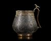 A VERY RARE AND IMPORTANT EARLY ISLAMIC PARCEL-GILT CUP