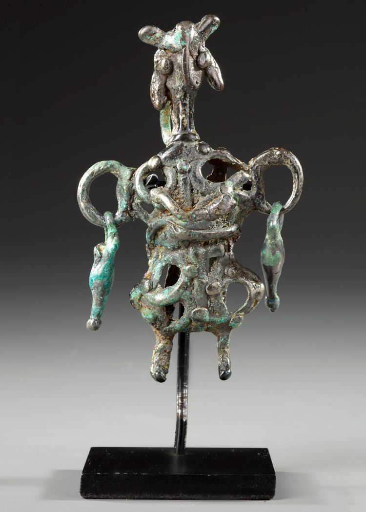A WESTERN ASIATIC AMLASH OPENWORK BRONZE IDOL, CIRCA 1ST MILLENNIUM B.C.