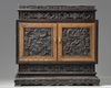A small Chinese carved zitan cabinet