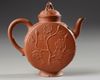 A Chinese yixing 'peony and chilong' flattened teapot and cover