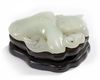 A Chinese pale celadon jade 'twin catfish' carving