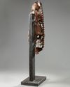 An Indian wood sculpture of a lady on a marble stand