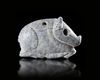 A RECLINING BOAR AMULET IN VARIEGATED GREY CALCITE, 3000-2000 BC