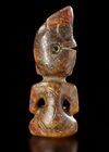 A RUSSET JADE SITTING FIGURE WEARING A PIG DRAGON ON IT'S HEAD, CHIN, HONGSHAN CULTURE