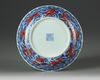 A Chinese iron-red-decorated blue and white 'dragon' dish