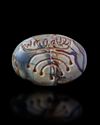 AN OVAL AGATE SEAL WITH A MENORAH, 4TH CENTURY BC