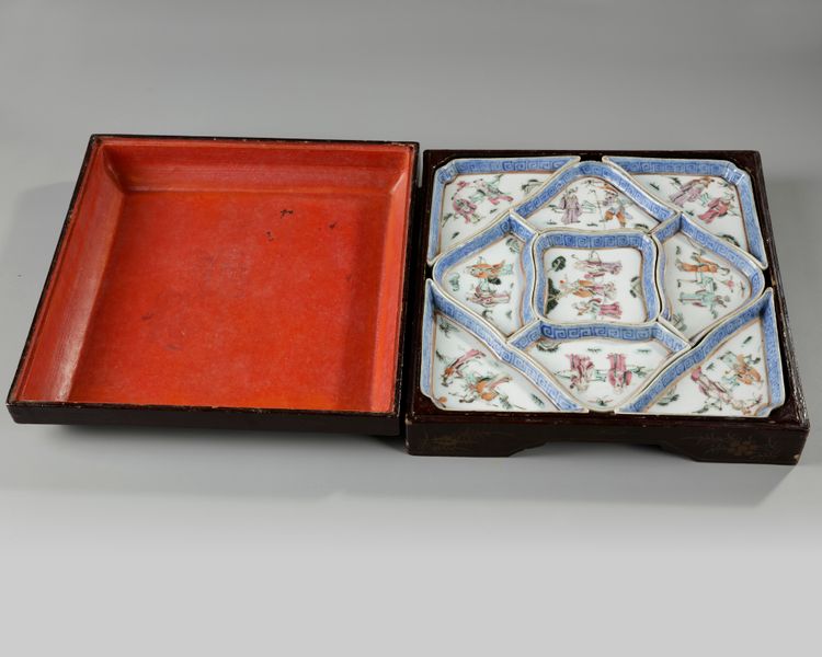 A set of Chinese famille rose 'Immortals' sweetmeat dishes in a lacquered box