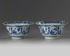 A pair of Chinese blue and white ‘floral’ klapmuts bowls