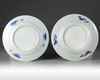 A pair of Chinese blue and white 'flower basket' dishes