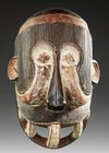 AN AFRICAN MASK, 20TH CENTURY