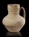A SELJUK POTTERY UNGLAZED JUG, PERSIA, 12TH CENTURY