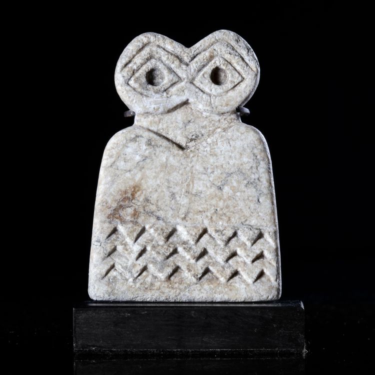 AN EYE IDOL MADE OF CALCITE, NEAR EASTERN, 3RD MILLENNIUM BC