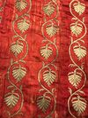 AN OTTOMAN EMBROIDERED DEEP RED SILK PANEL