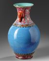 A CHINESE ROBINS-EGG AND FAMILLE-ROSE REVOLVING VASE, QING DYNASTY (1644-1911)