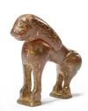 A BRONZE FATIMID MIRROR HANDLE IN THE FORM OF A LION, 11TH CENTURY