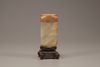 A pale celadon and russet jade cong