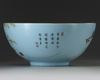A large Chinese sgraffiato pale-blue-ground famille rose punch bowl